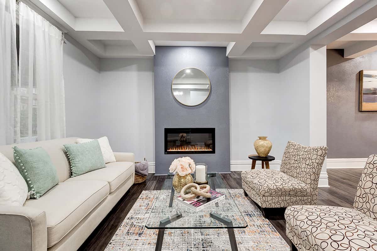 Grey feature wall with fireplace — Inoa Construction project